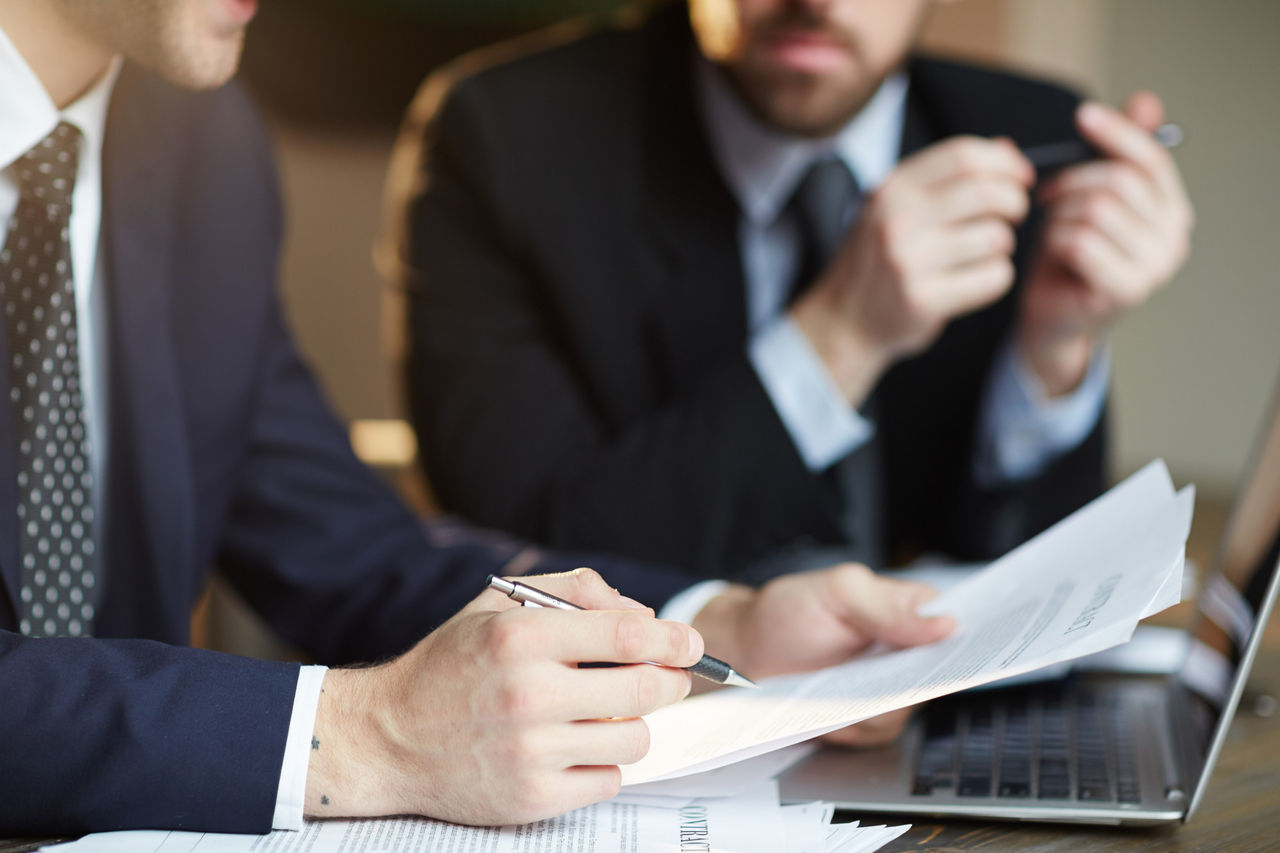 Two business men looking at documents