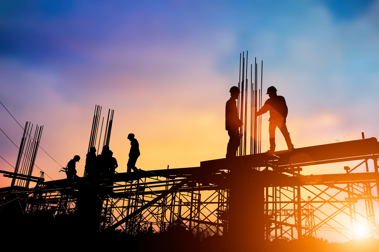 Silhouette of workers in a construction site