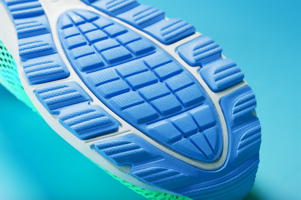Fragment of the sole of a blue sneaker close-up. Textured texture of the material of sports shoes. Stylish shoes for running and training in the gym.; Shutterstock ID 1916875796; purchase_order: POL_Omyasphere ; job: Omyasphere 900 flyer; client: ; other:
1916875796