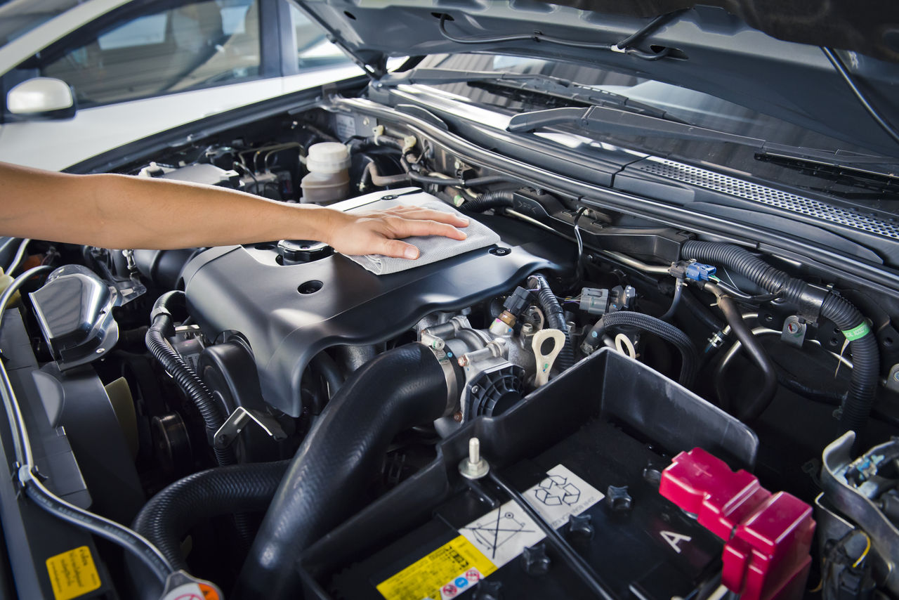 Worker man open the car hood and polishing car with microfiber cloth ,vintage tone; Shutterstock ID 395648884; purchase_order: GDS Microsite Green Polymers