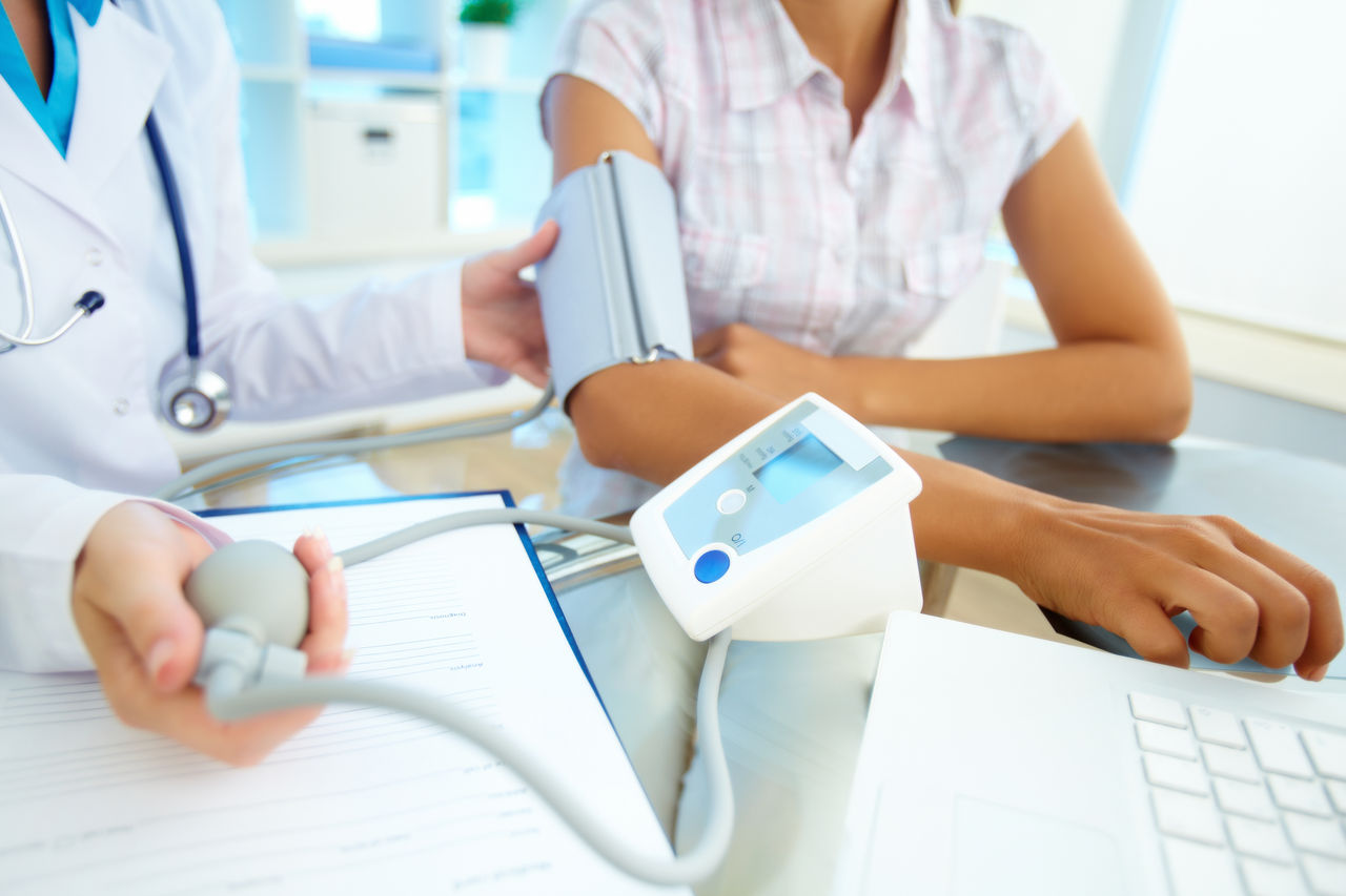 Close-up of tonometer by patientÃ?Â¢??s arm during blood pressure measuring at medical consultation
110196416