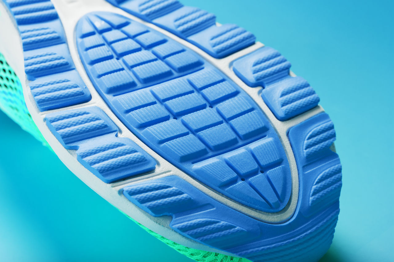 Fragment of the sole of a blue sneaker close-up. Textured texture of the material of sports shoes. Stylish shoes for running and training in the gym.; Shutterstock ID 1916875796; purchase_order: POL_Omyasphere ; job: Omyasphere 900 flyer; client: ; other:
1916875796