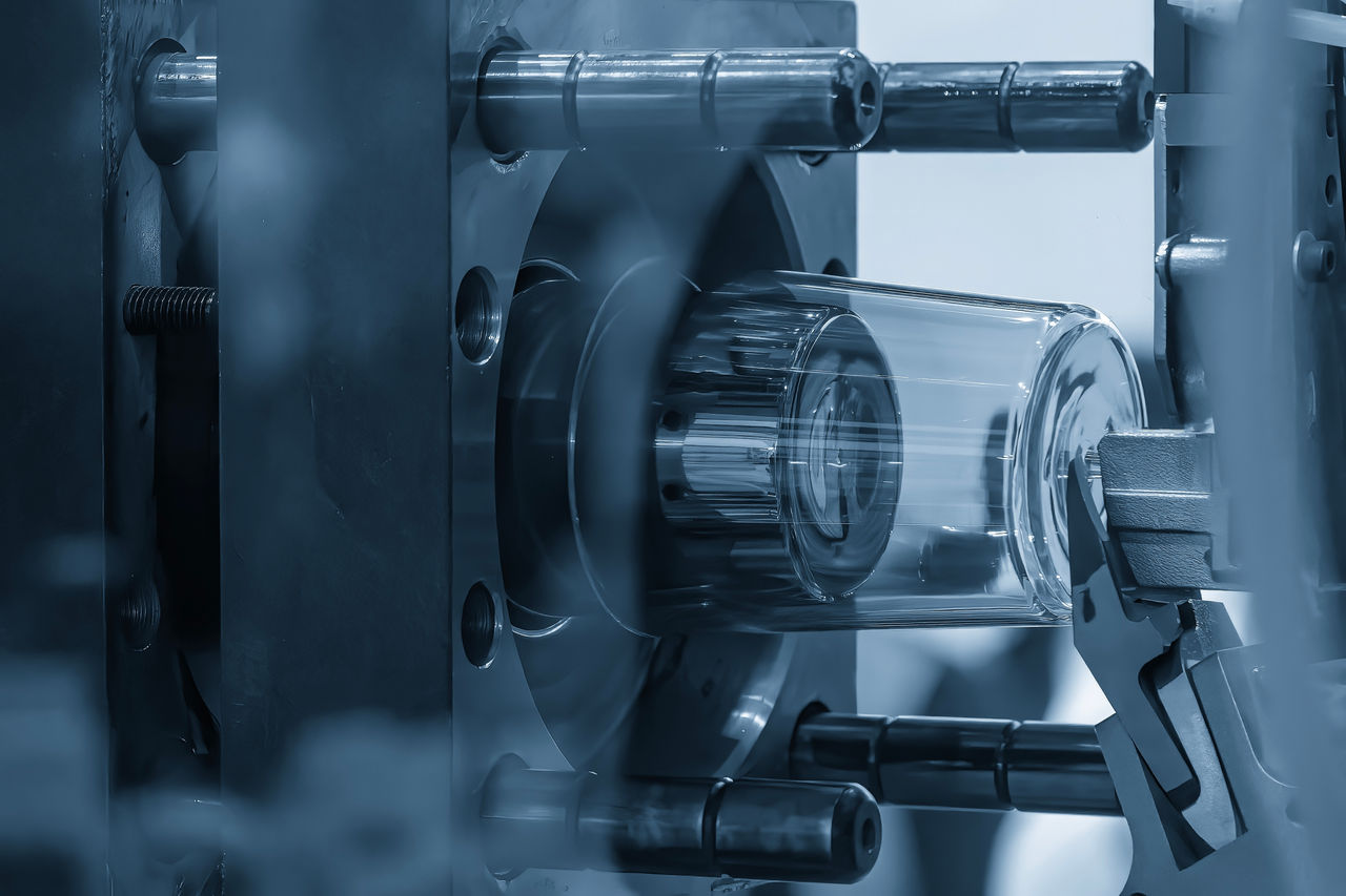 The plastic parts production process from injection mold machine. Close up scene the plastic glass parts from injection machine in the blue scene. ; Shutterstock ID 2690048681; purchase_order: OPP Website & Media; job: ; client: ; other: 