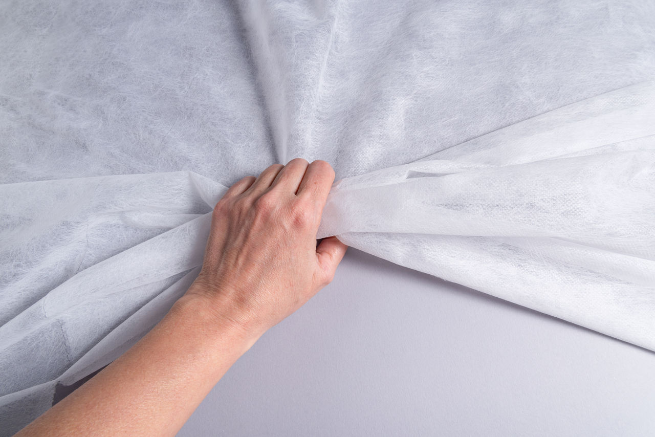 Hand grabbing non woven material