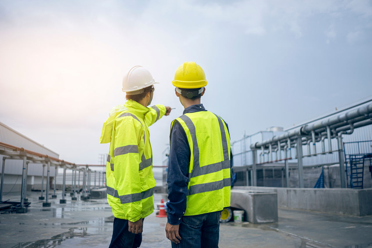 Mechanical engineer working install chilled water pipe system. Engineer consult discussion with team work for install pipe.; Shutterstock ID 1683287431; purchase_order: Animal Prod Guide; job: Animal Prod Guide; client: ; other: 