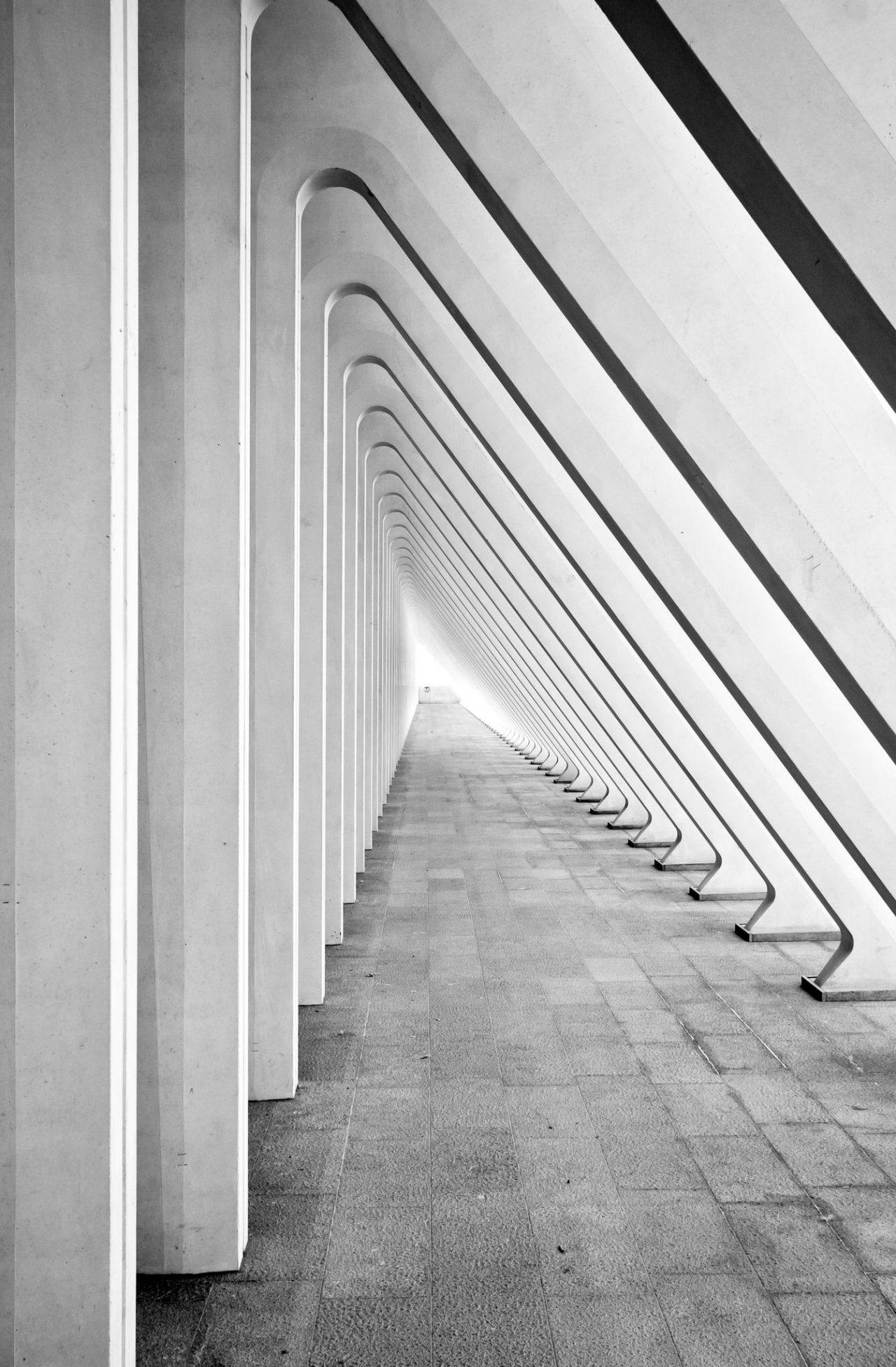 Modern tunnel in futuristic interior with concrete arches in perspective